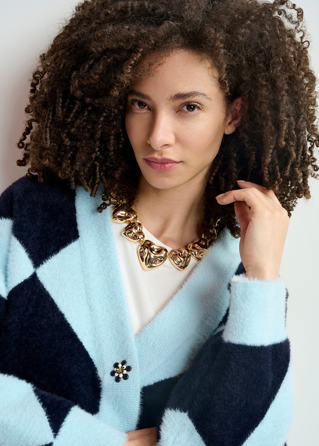 Gold-tone necklace with textured hearts