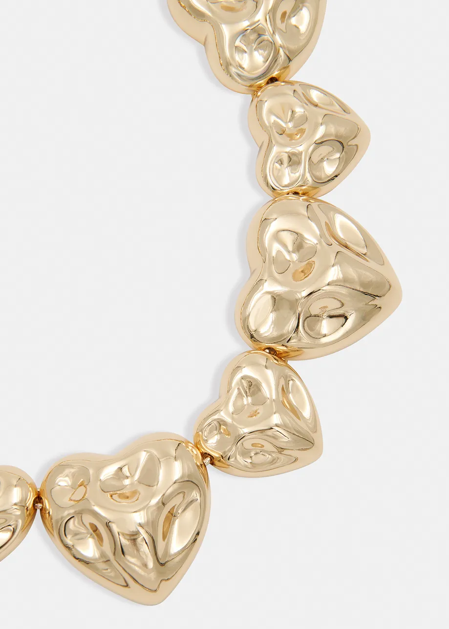 Gold-tone necklace with textured hearts