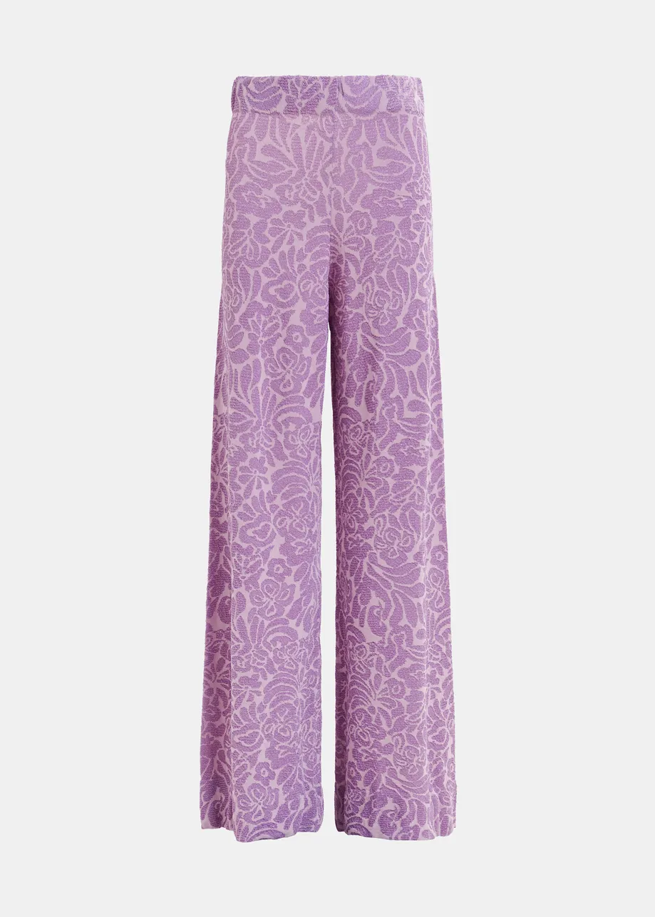 Pantaloni a gamba svasata in maglia jacquard floreale viola e malva