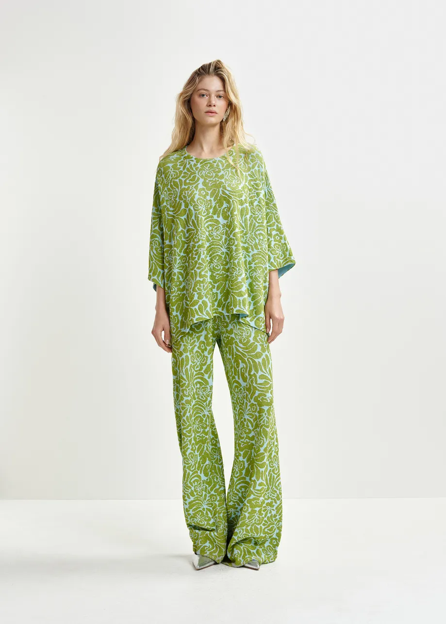 Groene en blauwe broek met olifantenpijpen in bloemenjacquard