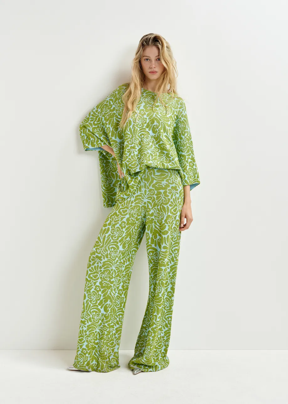 Groene en blauwe broek met olifantenpijpen in bloemenjacquard