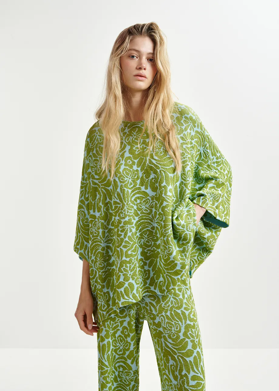 Groene en blauwe broek met olifantenpijpen in bloemenjacquard