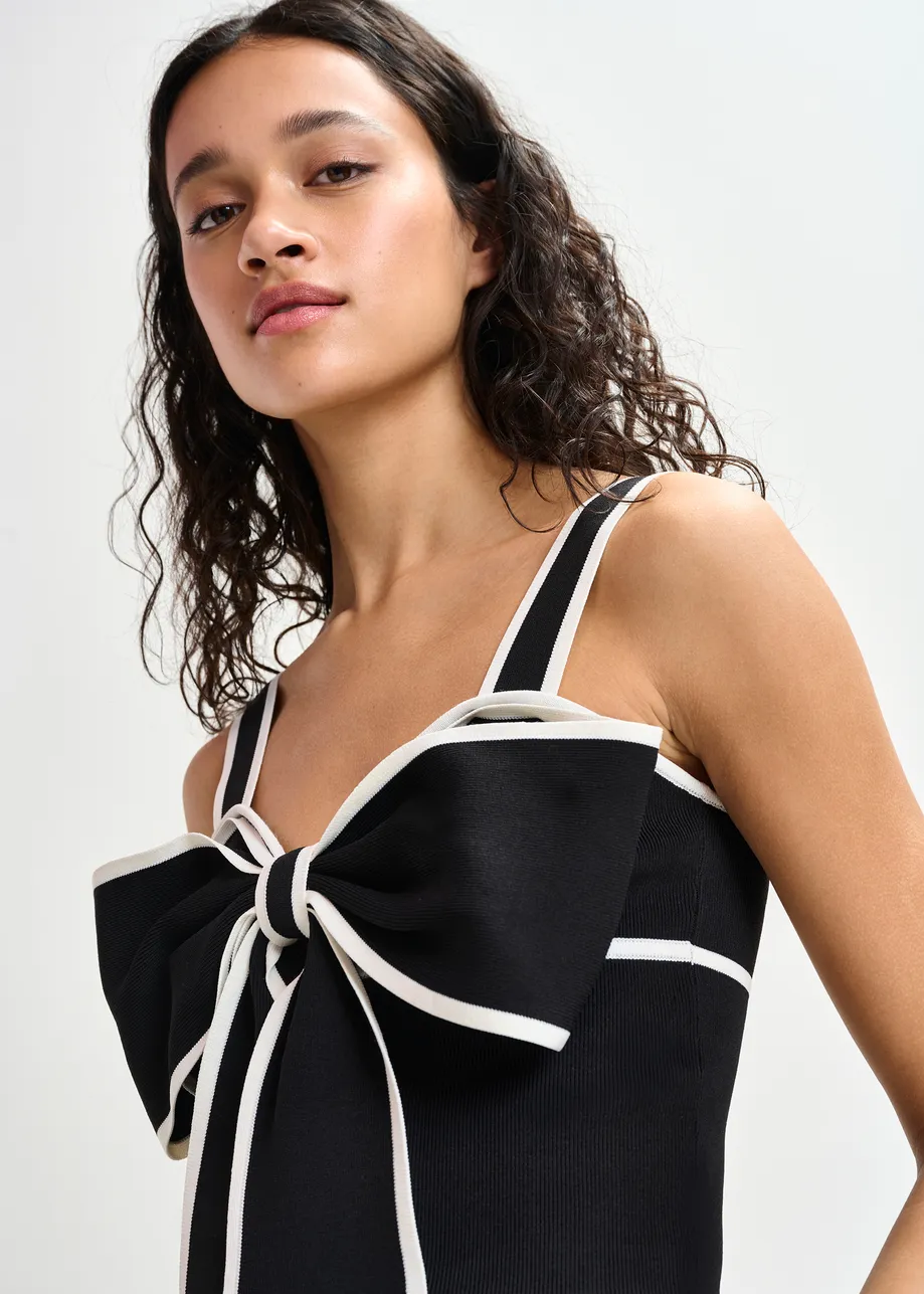 Black and white top with oversized bow and constrast trim