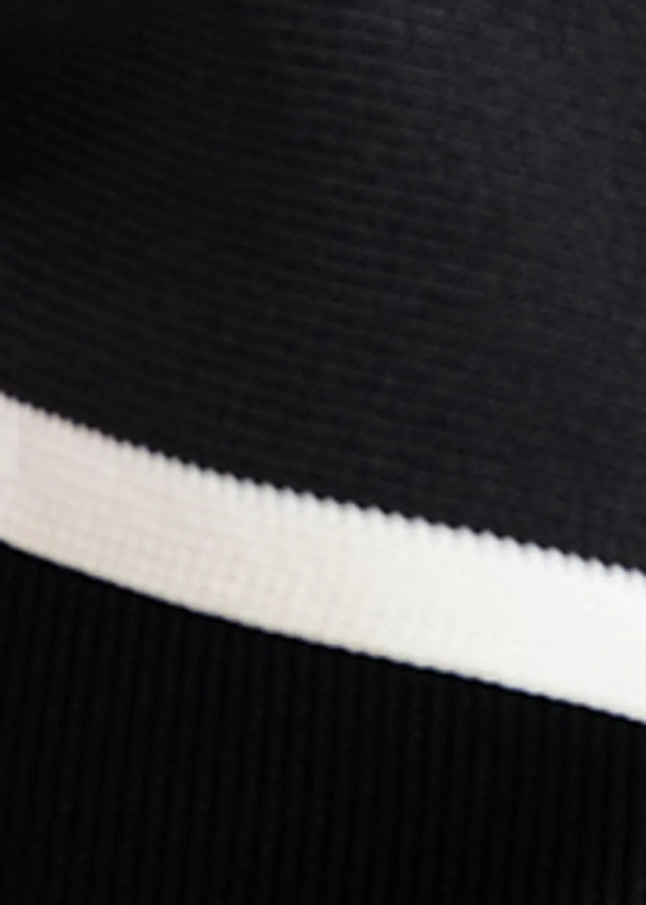 Black and white top with oversized bow and constrast trim