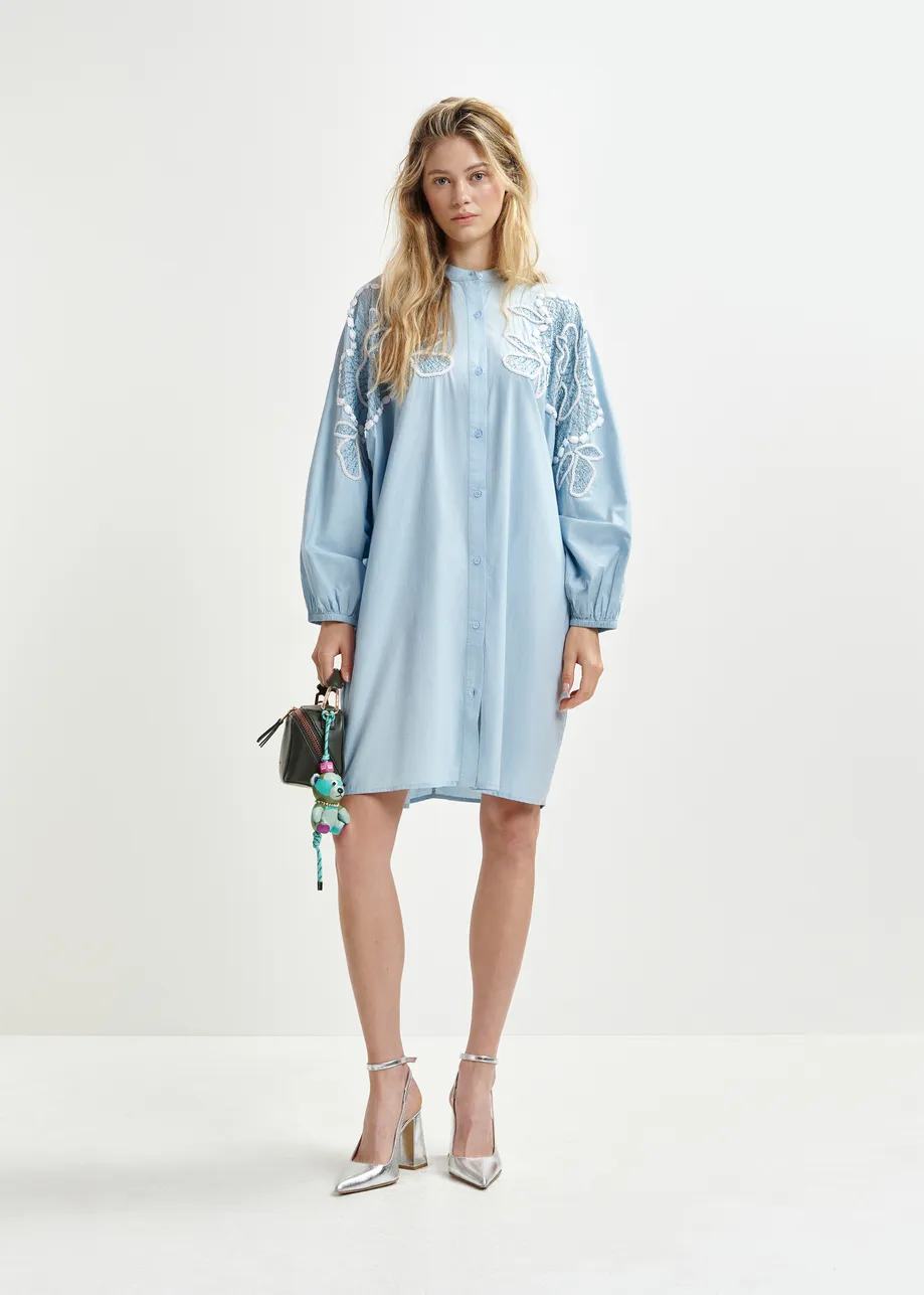 Light blue and white cotton shirt dress with bead embellishments and puffed sleeves