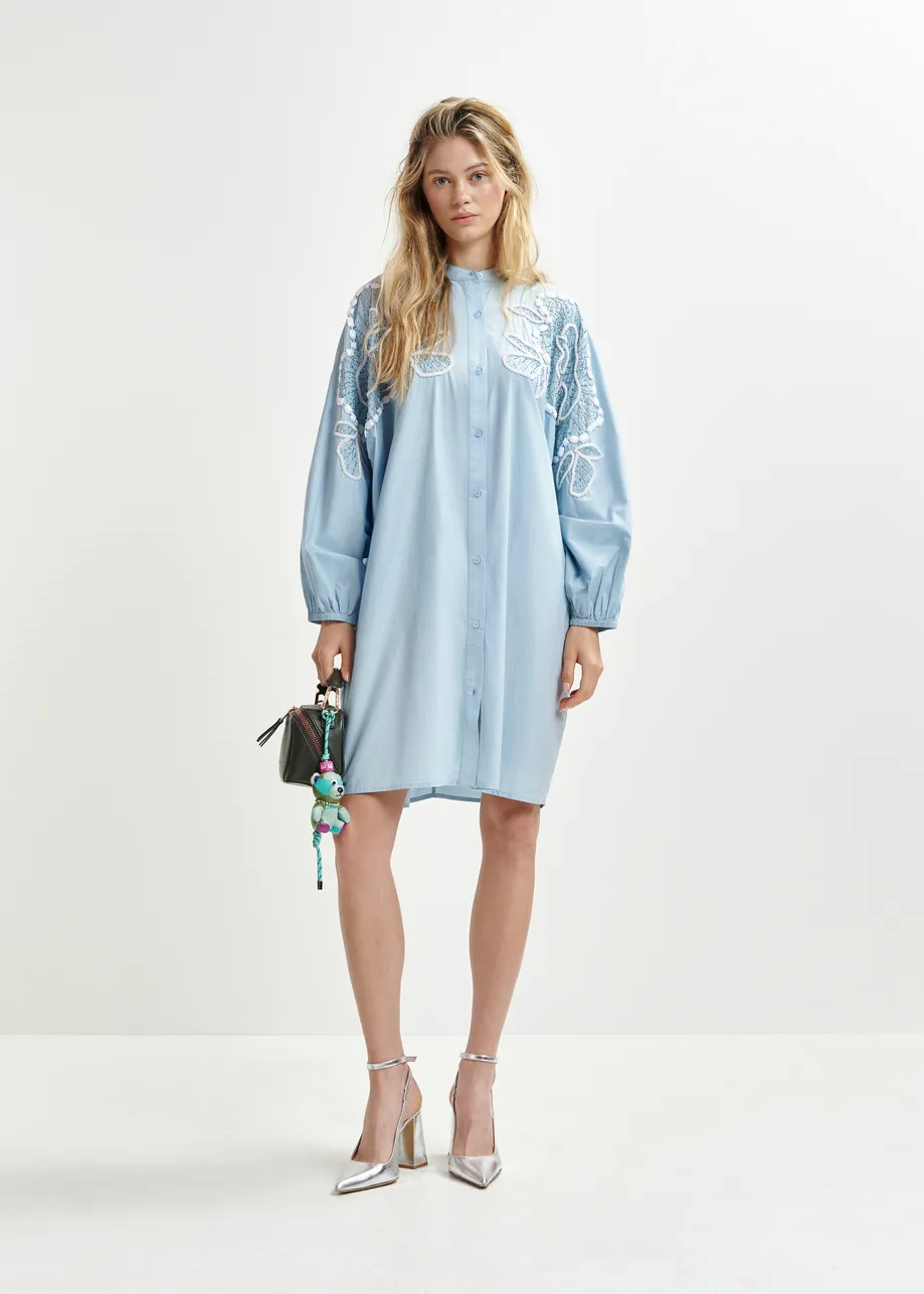 Light blue and white cotton shirt dress with bead embellishments and puffed sleeves