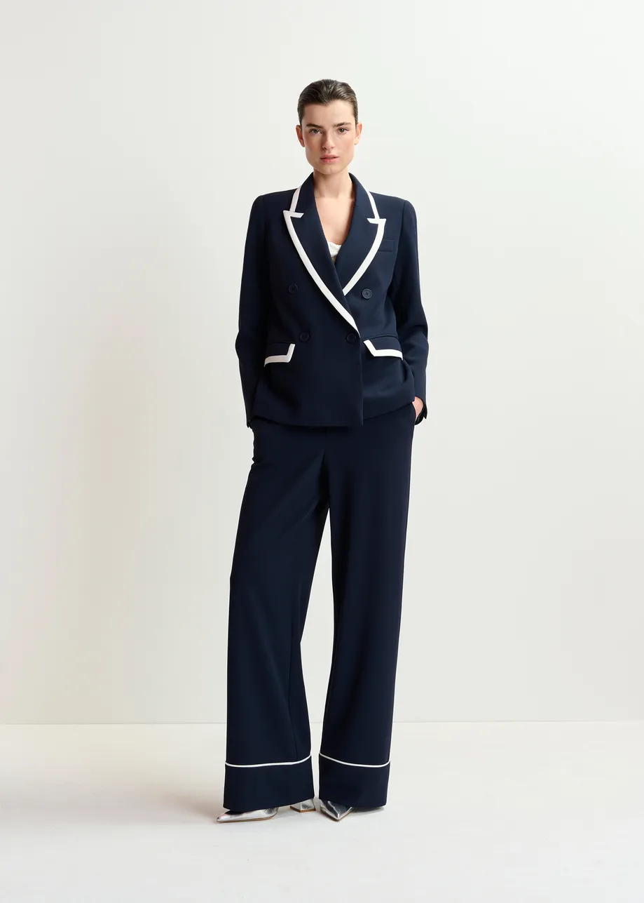 Dark blue and white wide-leg pants with contrasting trim