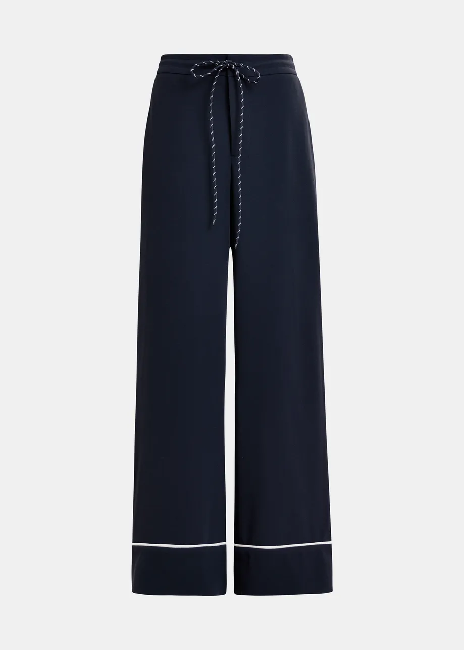 Dark blue and white wide-leg pants with contrasting trim