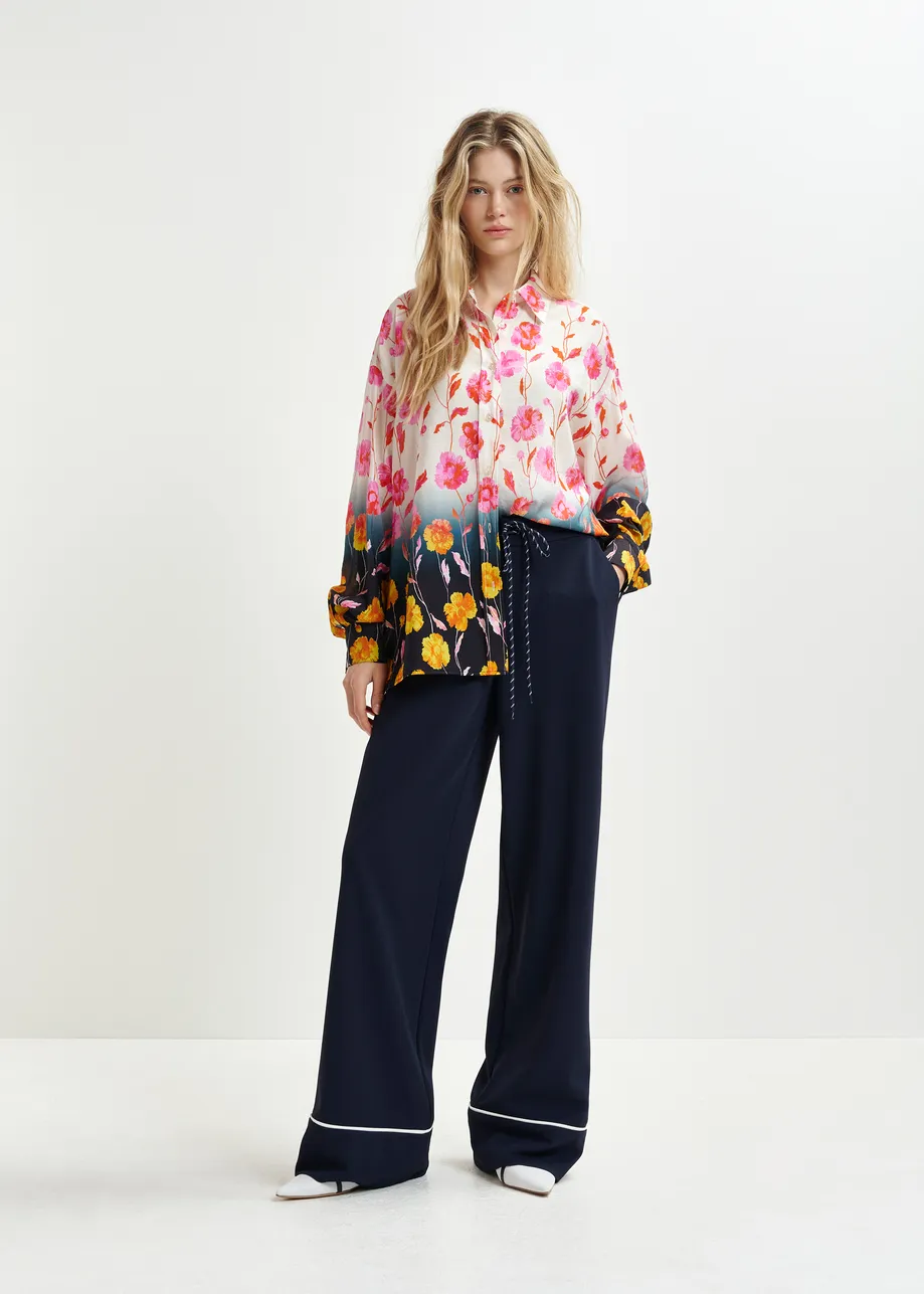 Dark blue and white wide-leg pants with contrasting trim