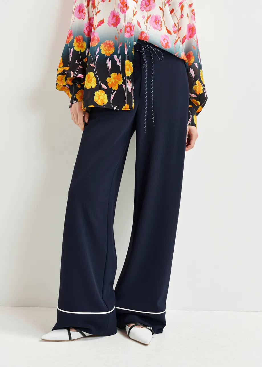 Dark blue and white wide-leg pants with contrasting trim