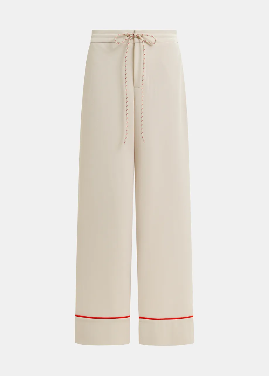 Pantalon large blanc cassé et rouge à bord contrasté