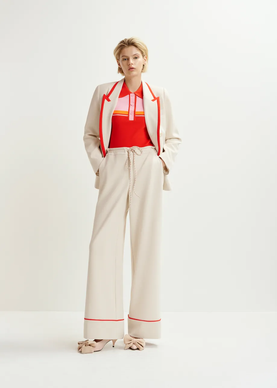 Off-white and red wide-leg pants with contrasting trim