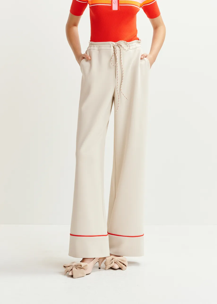 Off-white and red wide-leg pants with contrasting trim