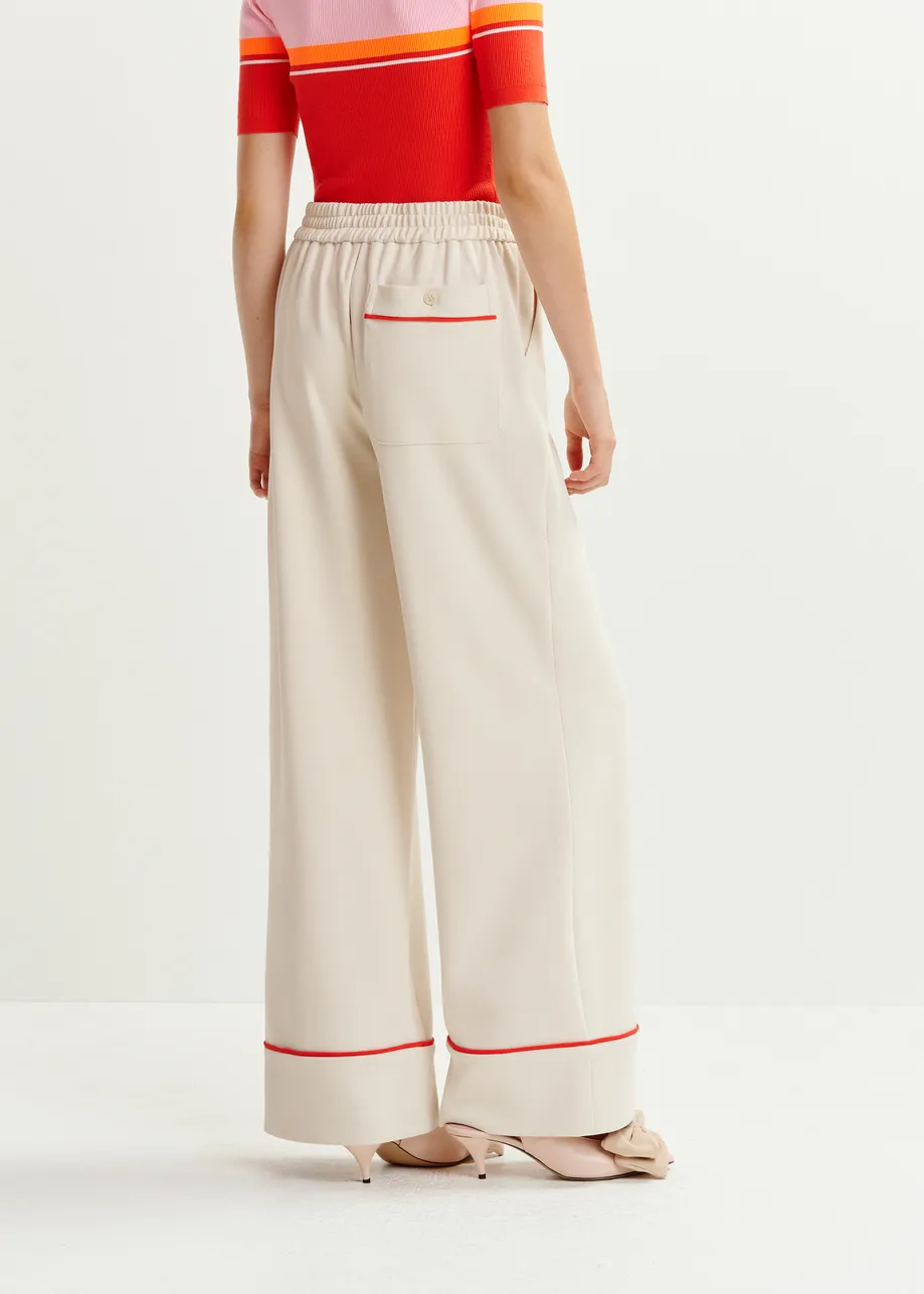 Off-white and red wide-leg pants with contrasting trim