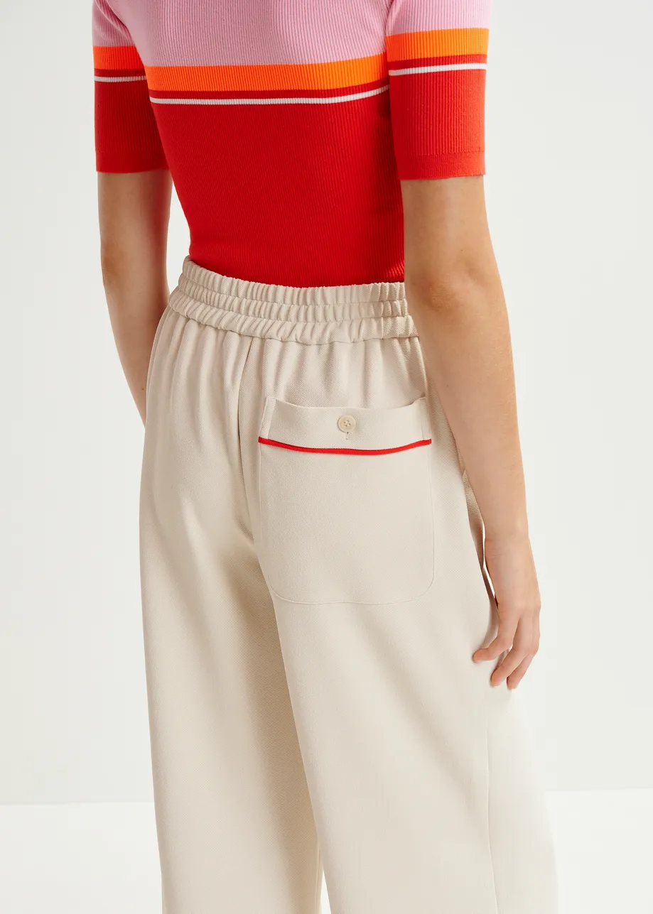 Off-white and red wide-leg pants with contrasting trim