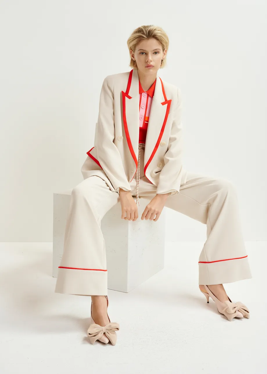 Off-white and red wide-leg pants with contrasting trim