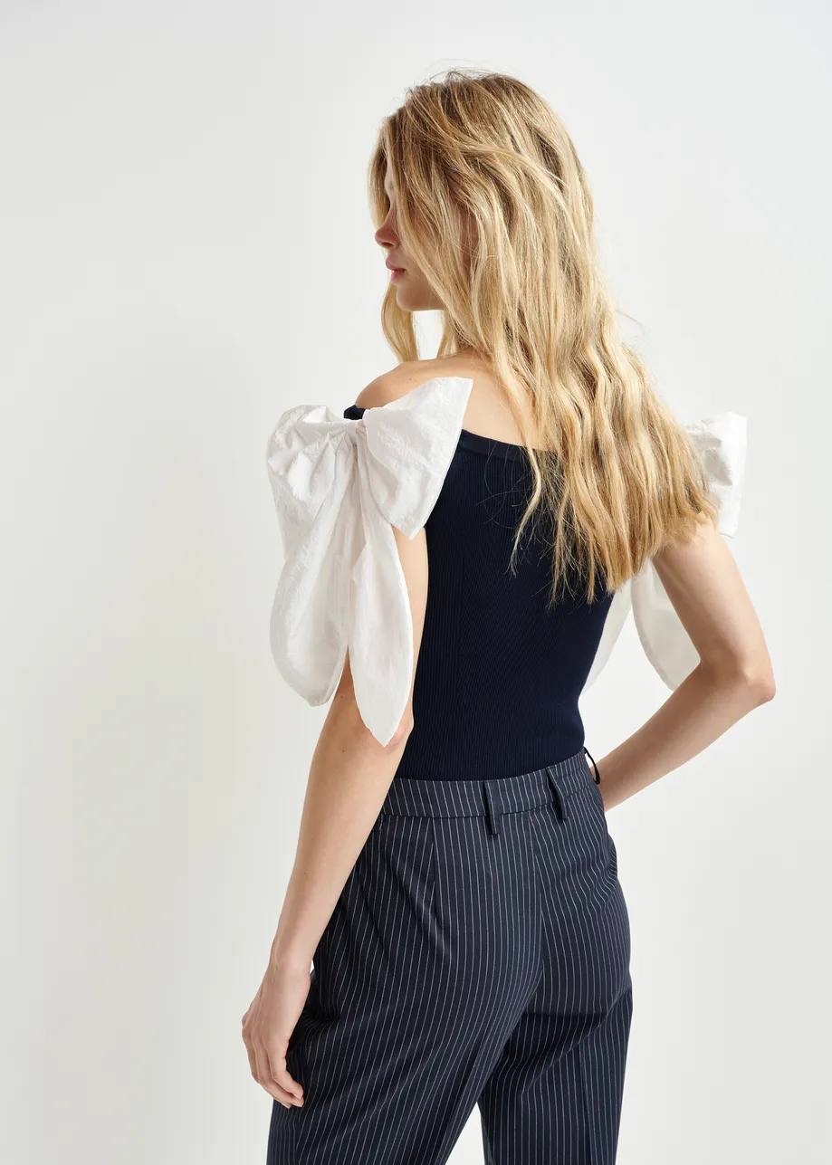 Dark blue and white off-the-shoulder knitted top with bow detail