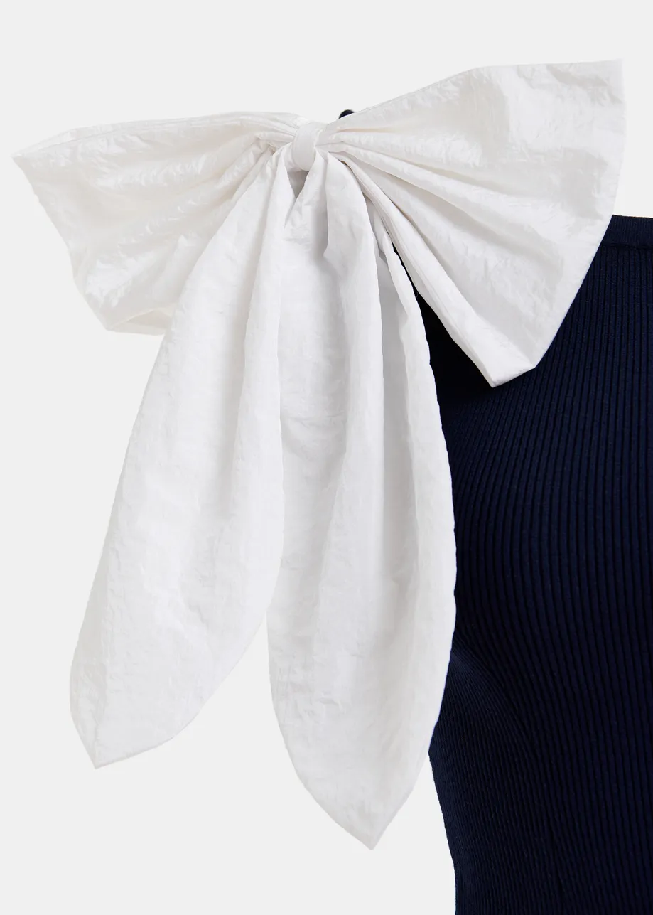 Dark blue and white off-the-shoulder knitted top with bow detail