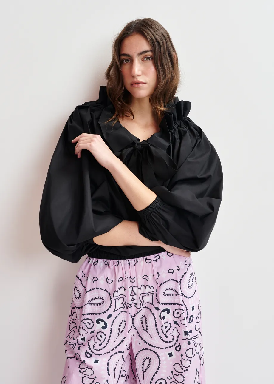 Black off-the-shoulder cotton top with ruffle details and self-tie collar