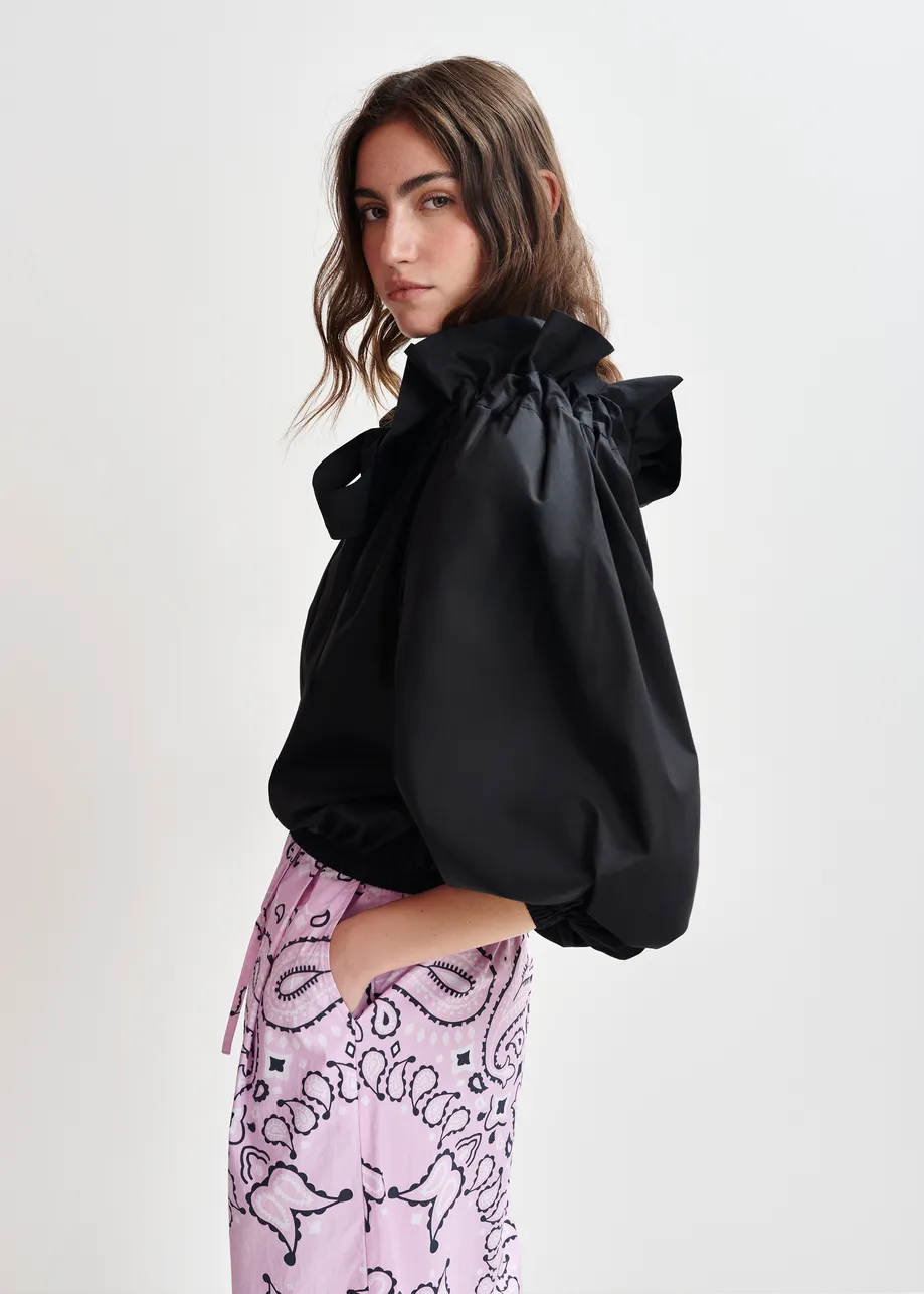 Black off-the-shoulder cotton top with ruffle details and self-tie collar
