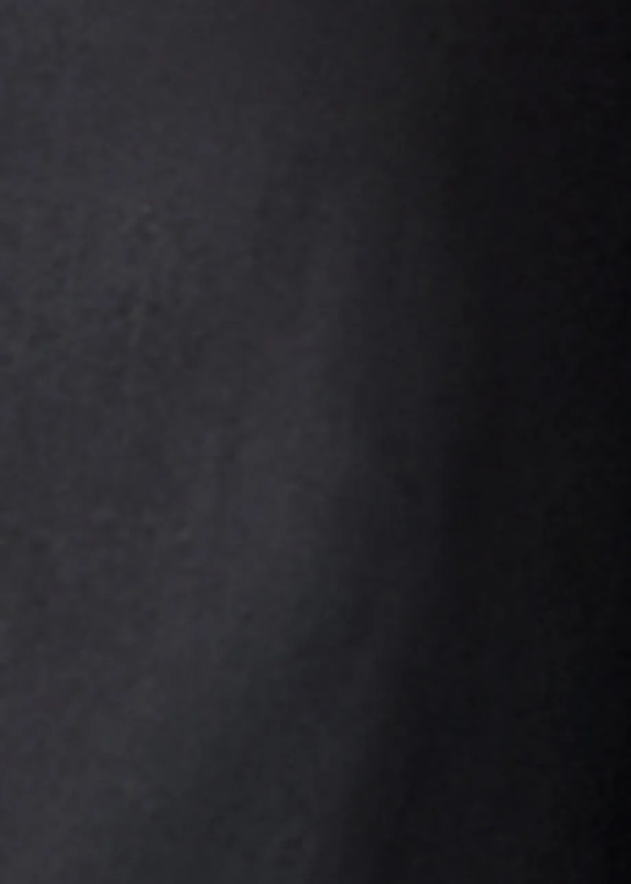 Black off-the-shoulder cotton top with ruffle details and self-tie collar
