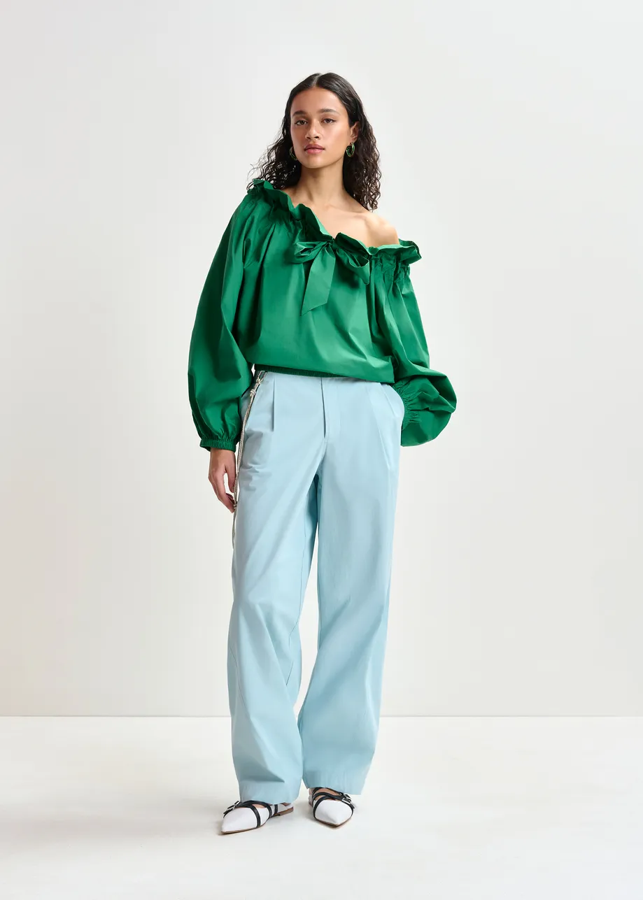 Green cotton top with ruffle details, voluminous sleeves, and self-tie collar