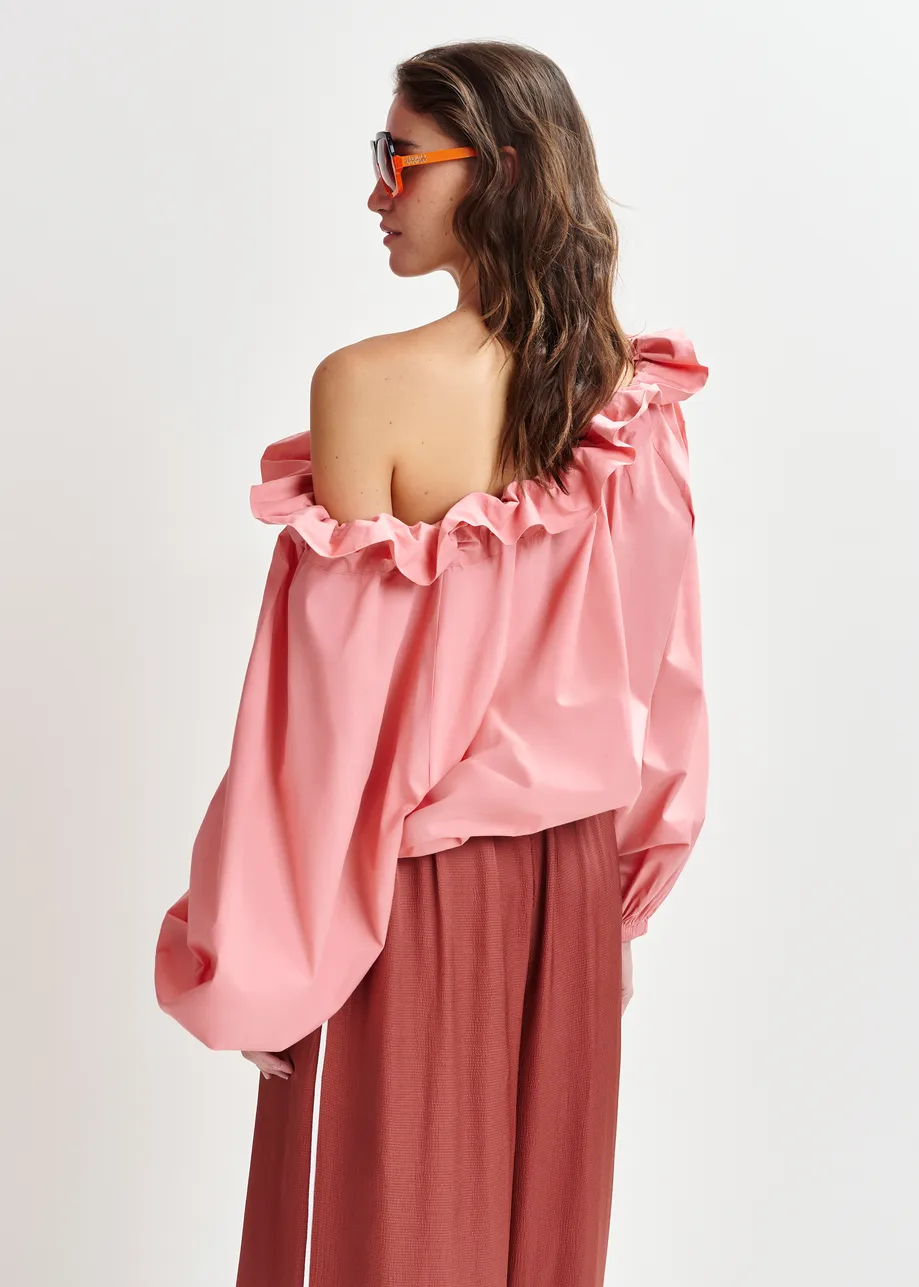 Pink cotton top with ruffle details, voluminous sleeves, and self-tie collar