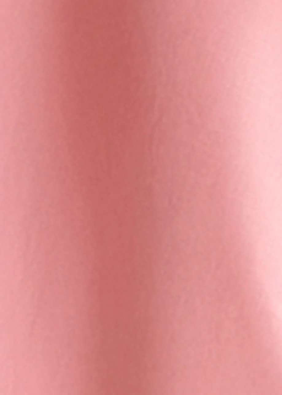 Pink cotton top with ruffle details, voluminous sleeves, and self-tie collar