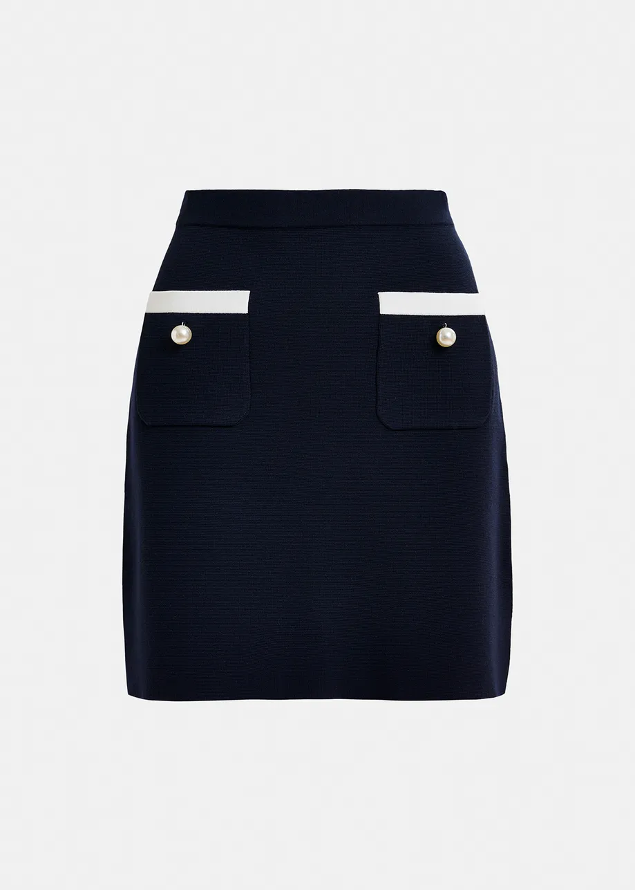 Dark blue knitted skirt with contrasting trims and pearl buttons