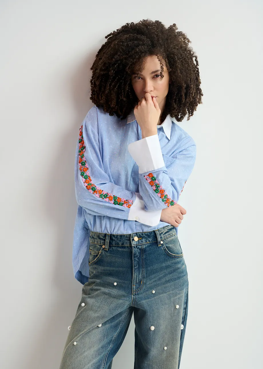 Blue and white pinstriped cotton shirt with flower embroidery