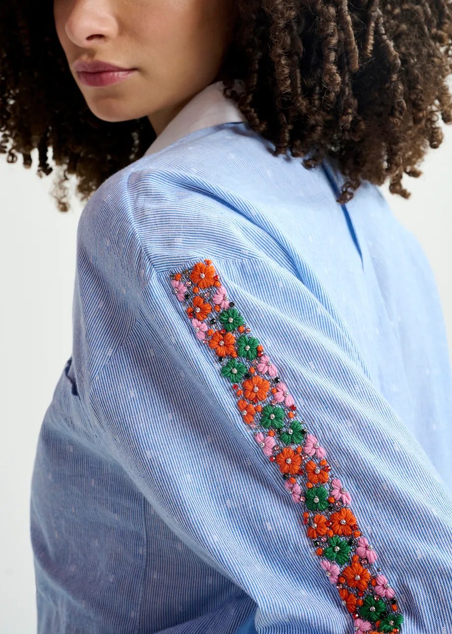 Blue and white pinstriped cotton shirt with flower embroidery