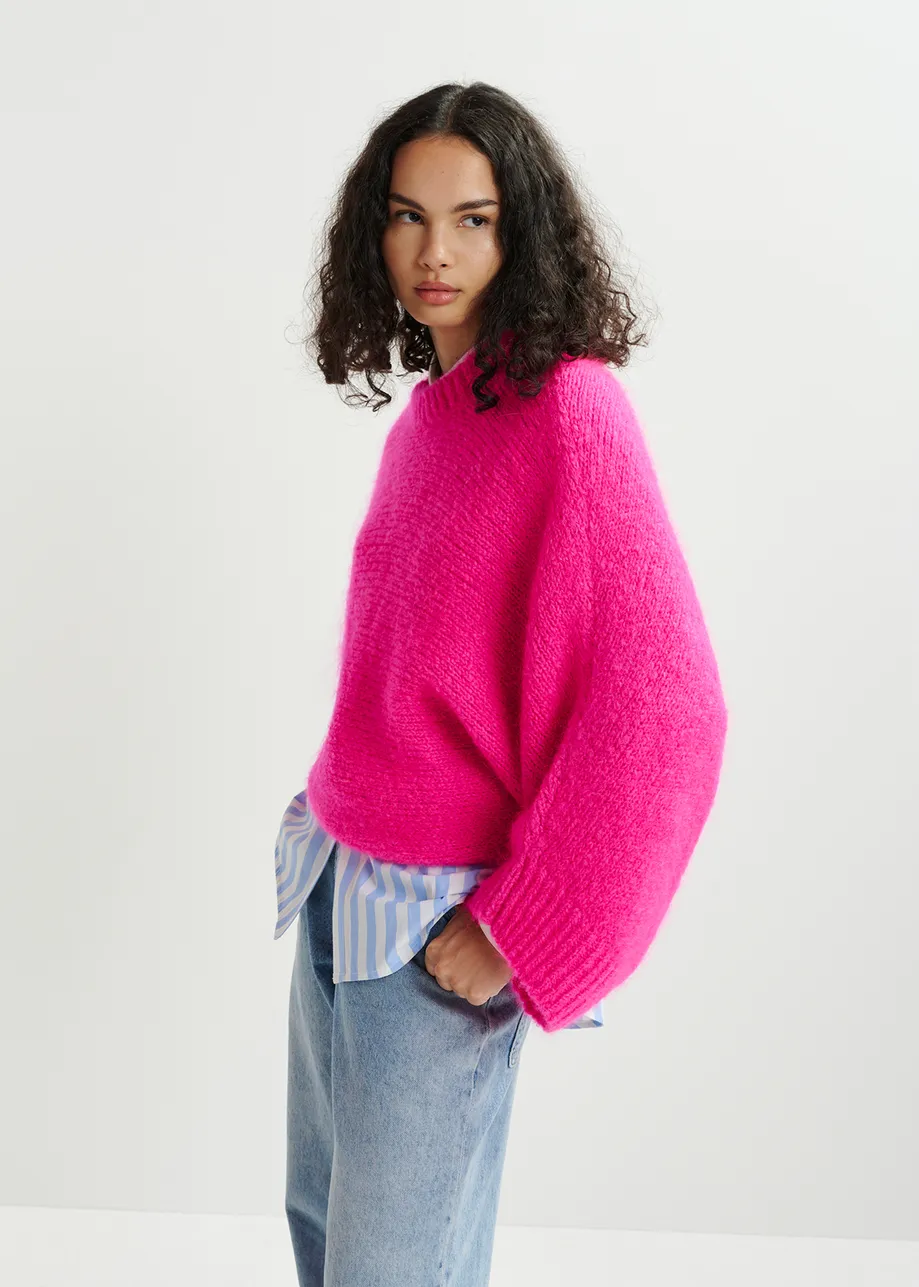 Bright pink mohair blend knit with batwing sleeves