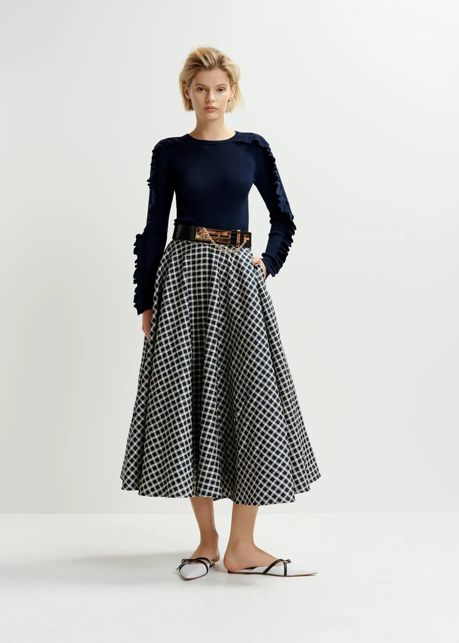 Dark blue and off-white pleated midi skirt with check pattern