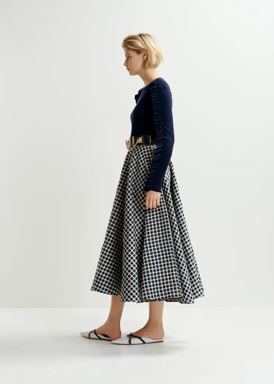 Dark blue and off-white pleated midi skirt with check pattern