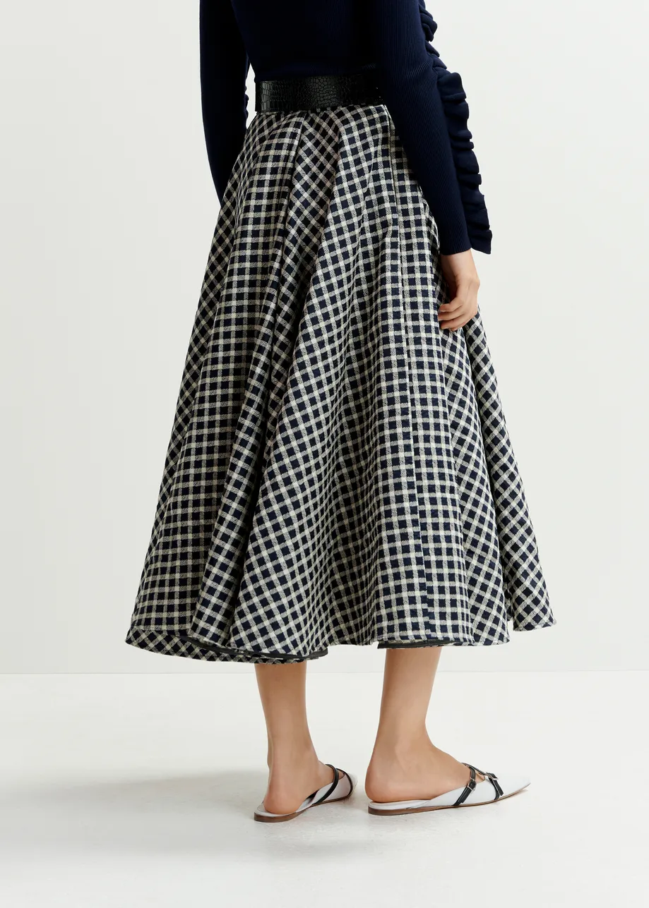 Dark blue and off-white pleated midi skirt with check pattern