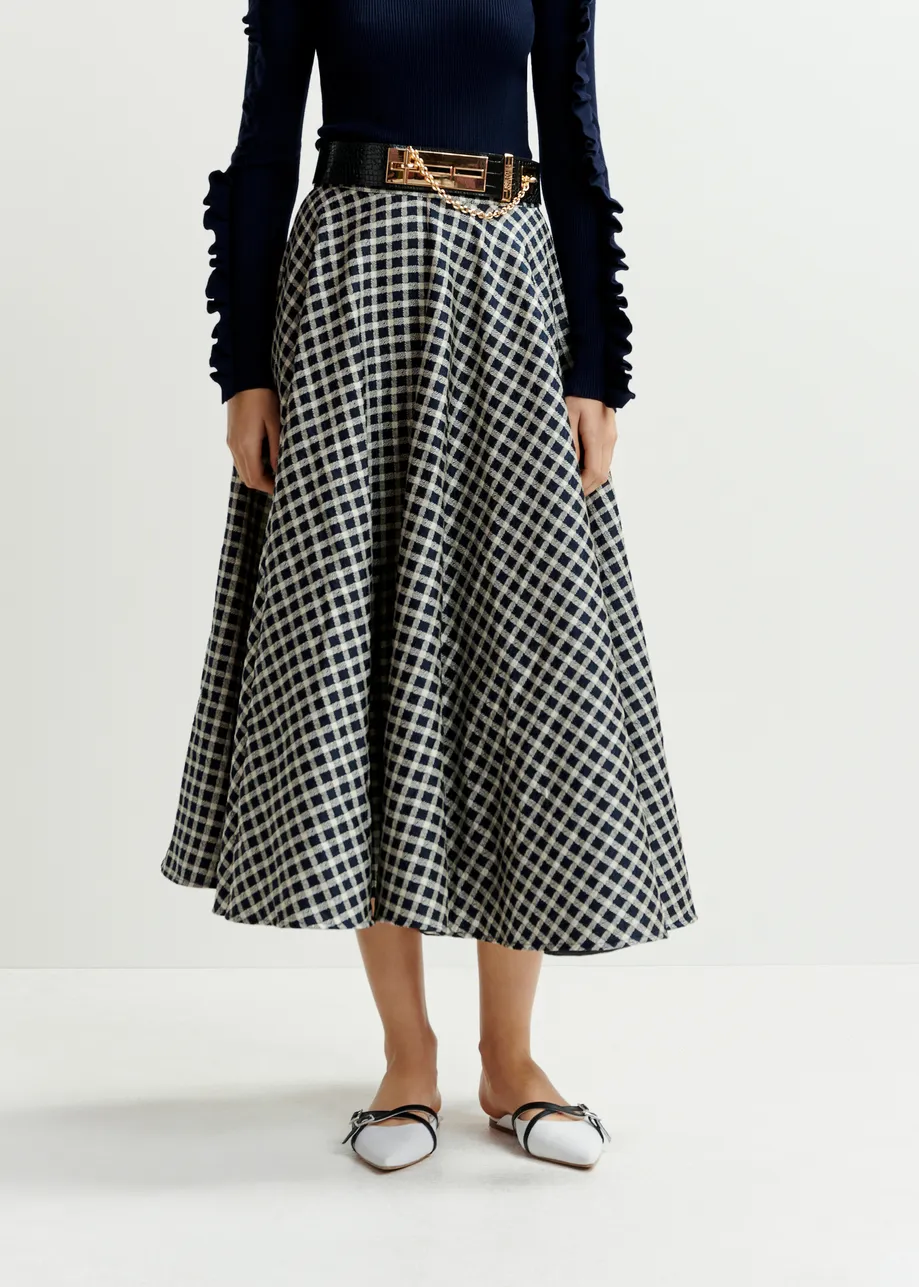 Dark blue and off-white pleated midi skirt with check pattern