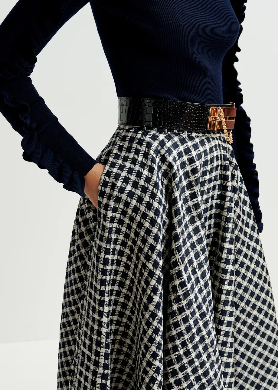 Dark blue and off-white pleated midi skirt with check pattern