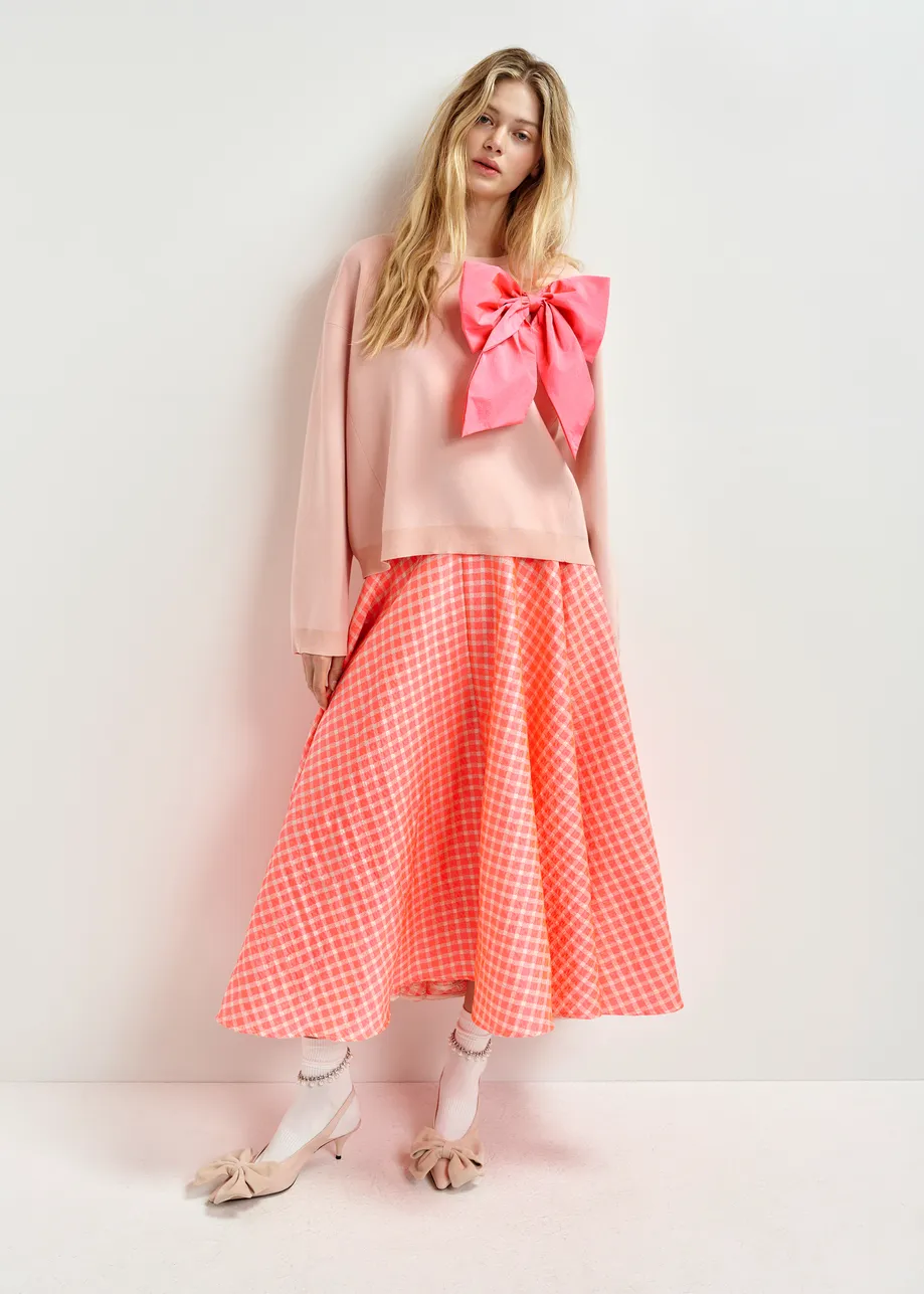 Orange and light pink pleated midi skirt with check pattern