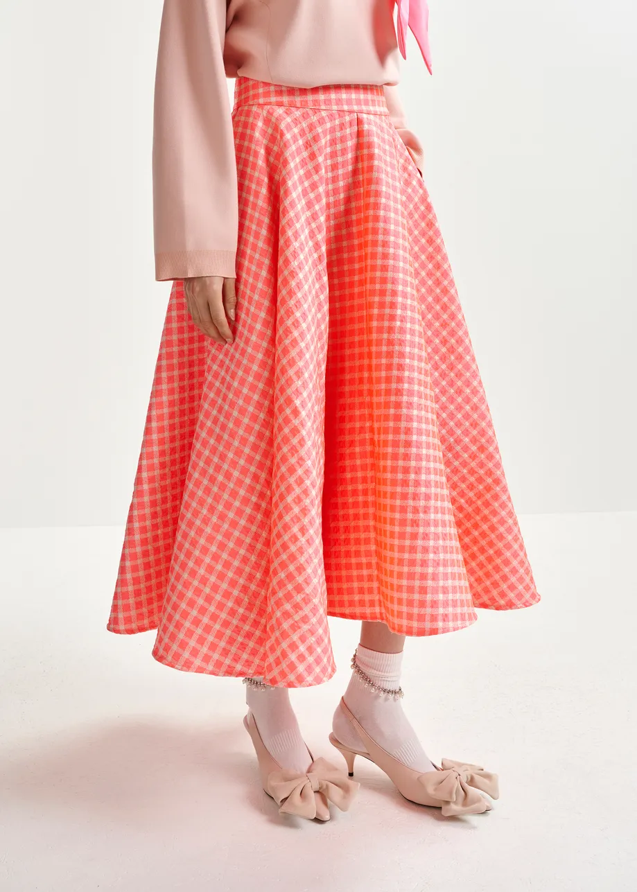 Orange and light pink pleated midi skirt with check pattern