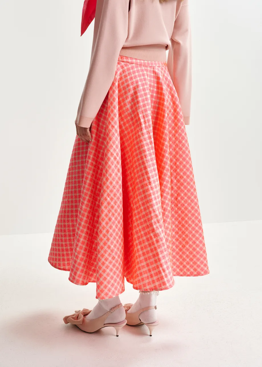 Orange and light pink pleated midi skirt with check pattern