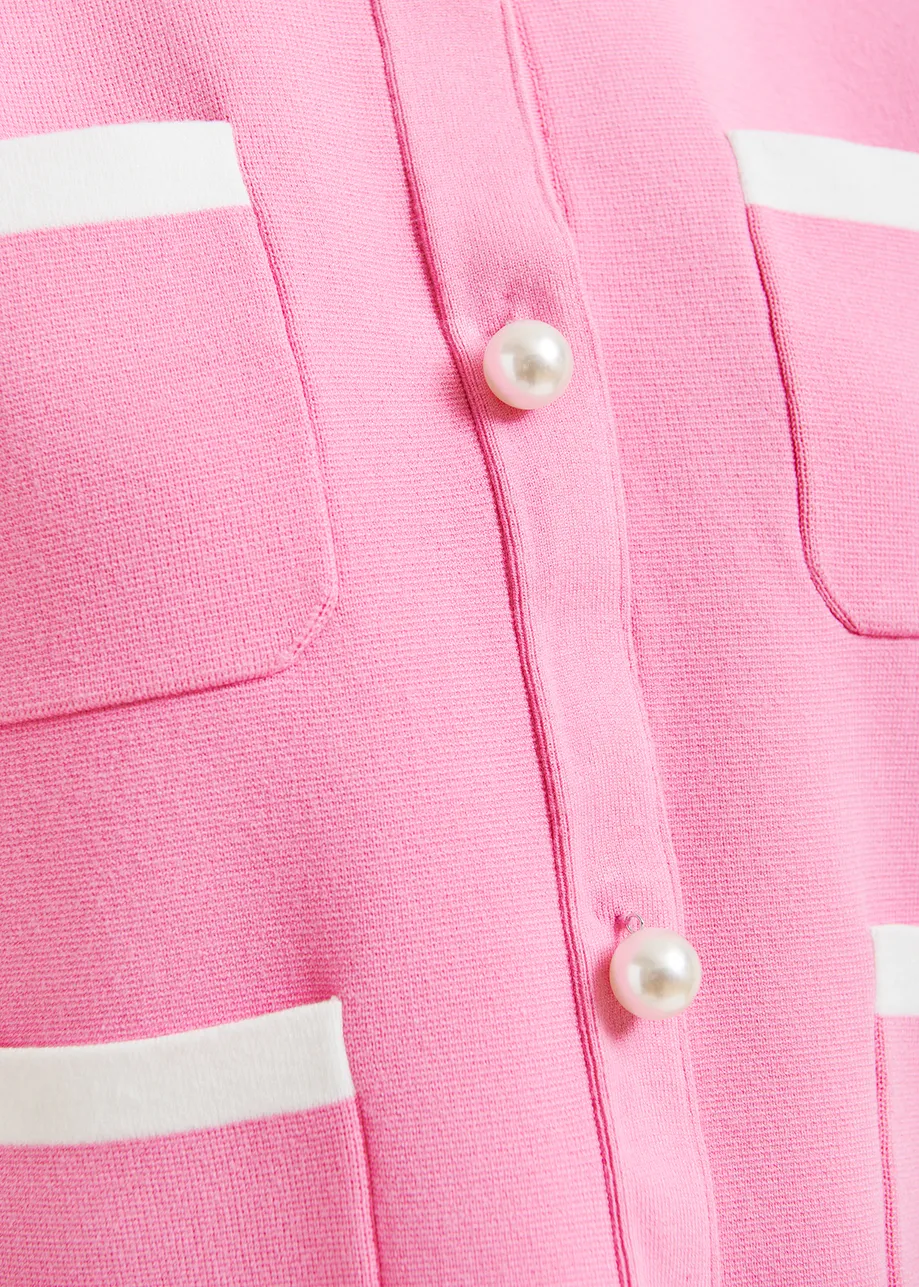 Pink knitted jacket with pearl buttons
