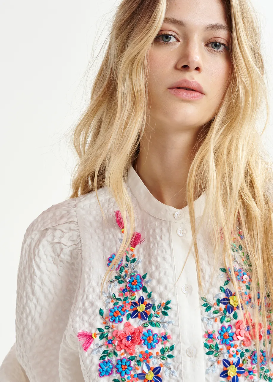 White sequin and bead-embellished shirt with voluminous sleeves