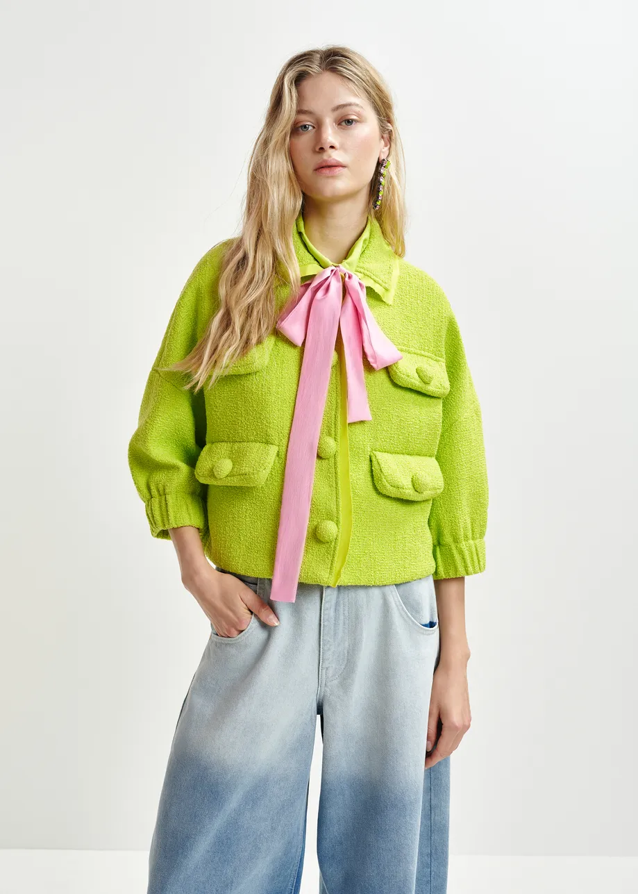 Bright green oversized jacket with 3/4 length voluminous sleeves