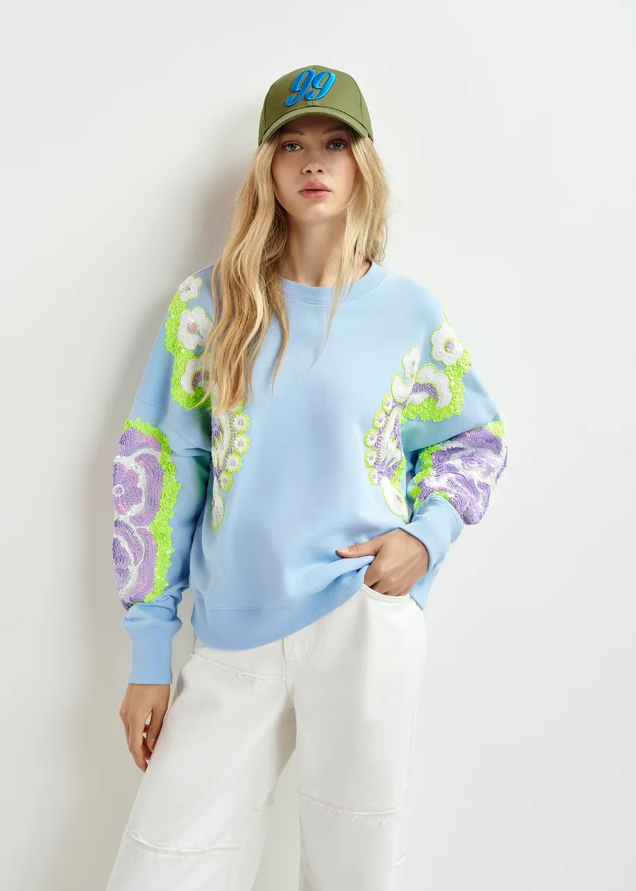 Light blue, green and purple organic cotton sweatshirt with sequin and bead-embroidered sleeves