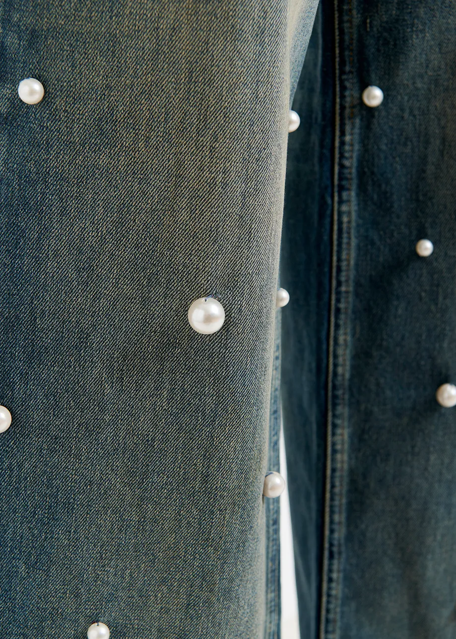 Blue pearl-embellished jeans