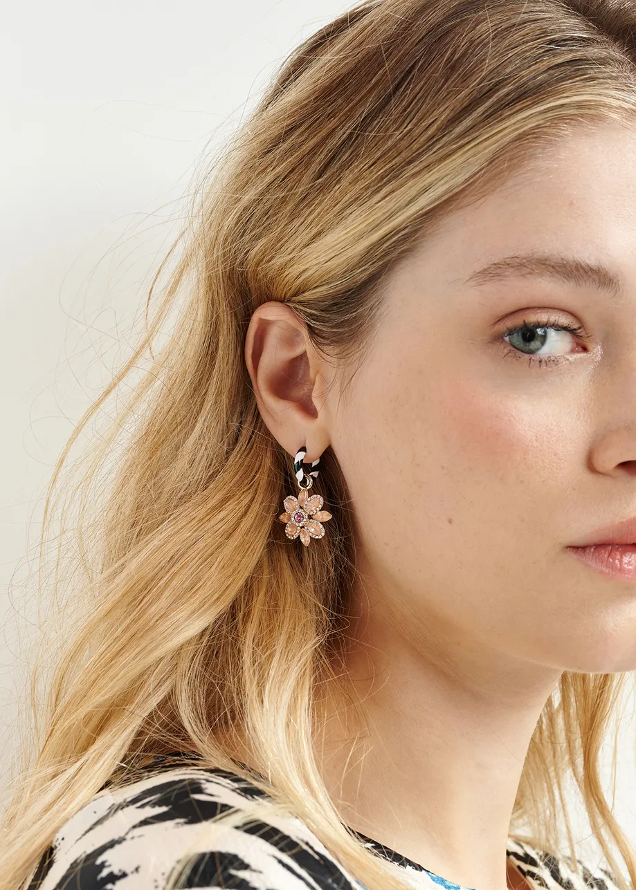 Black and white hoop earrings with flower and rocking horse pendants