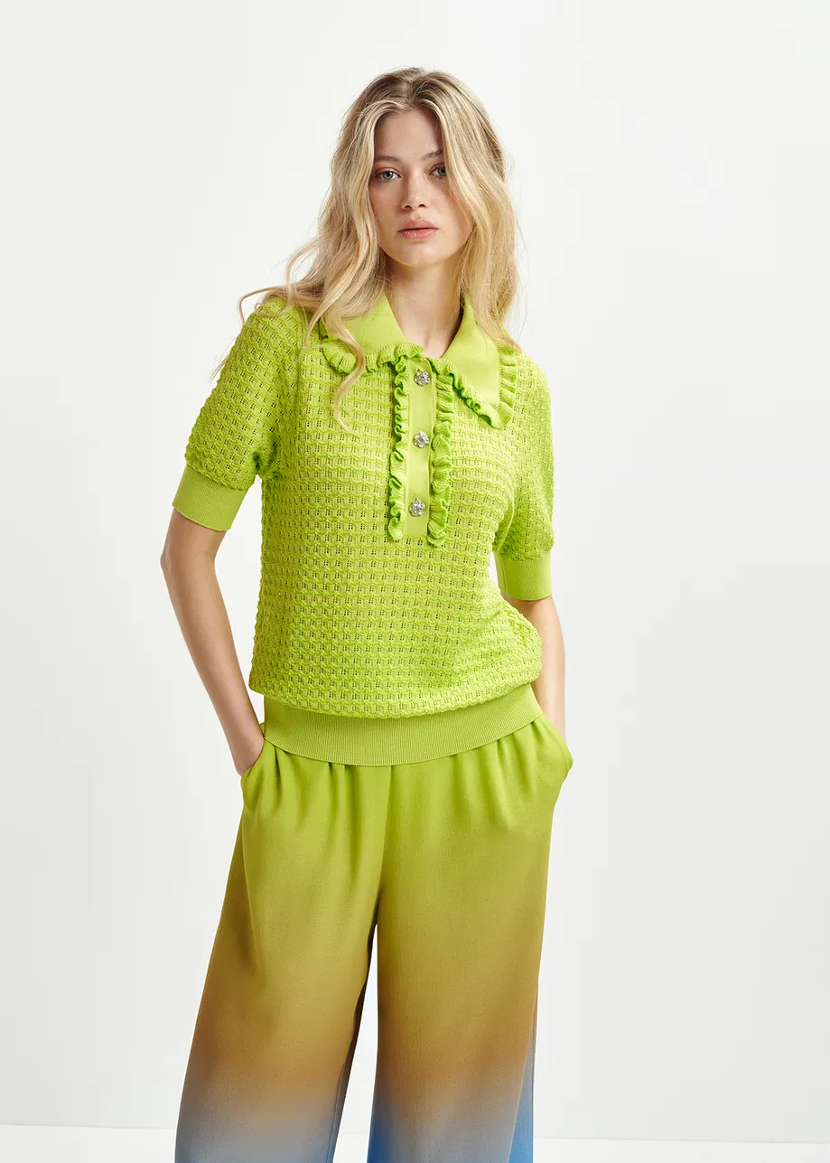 Lime green polo with ruffles and rhinestone-embellished buttons