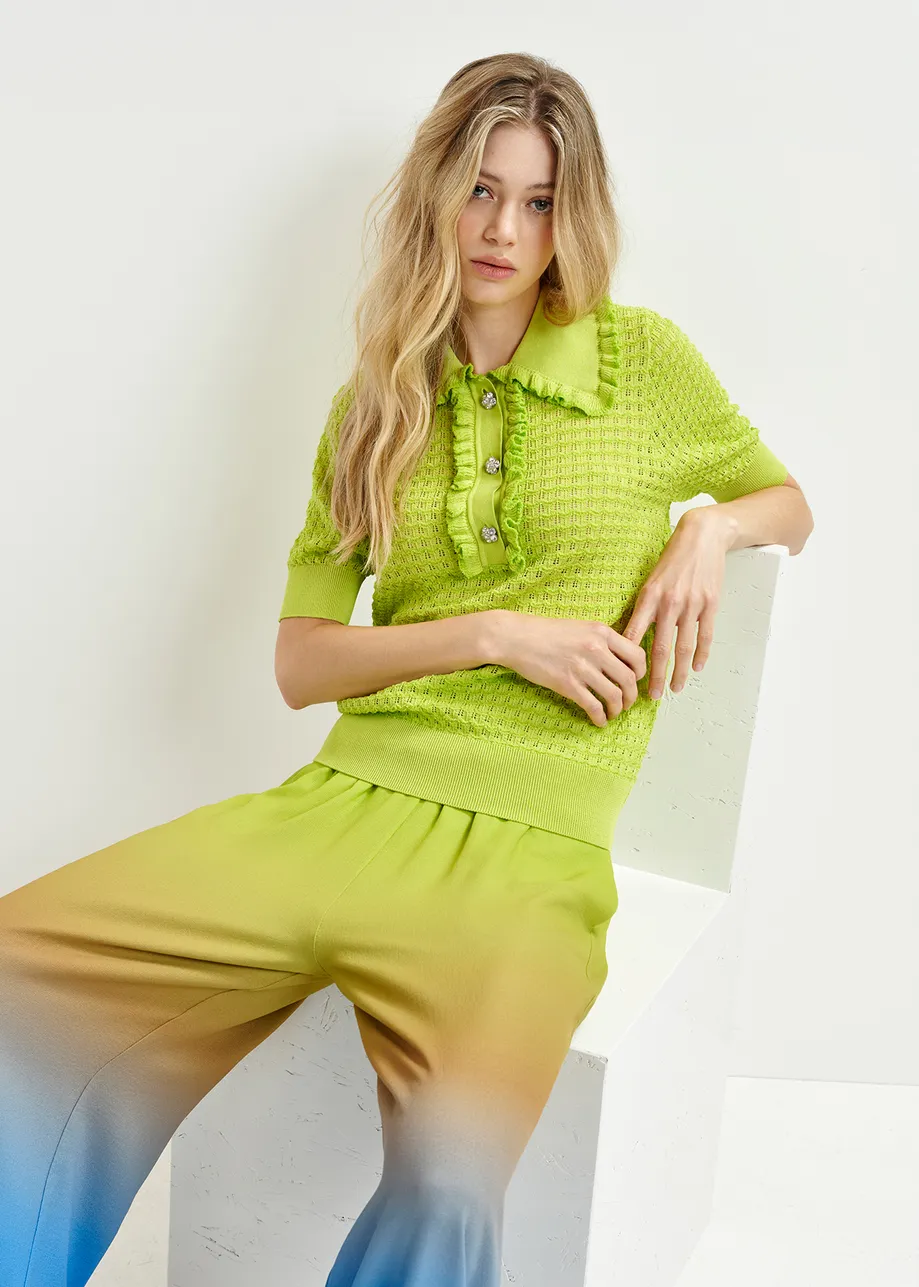 Lime green polo with ruffles and rhinestone-embellished buttons