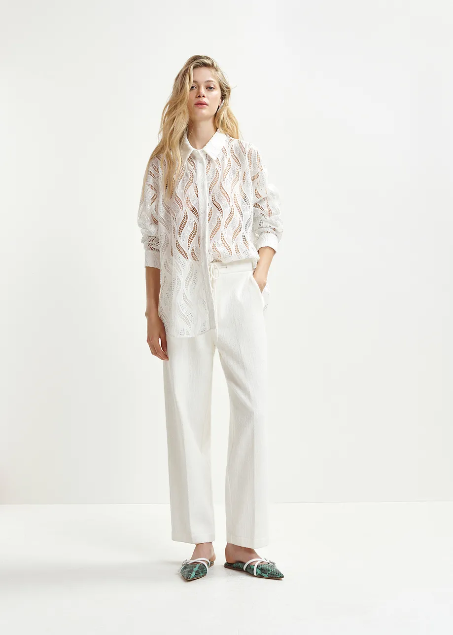 White broderie anglaise shirt with sequin and bead embellishments