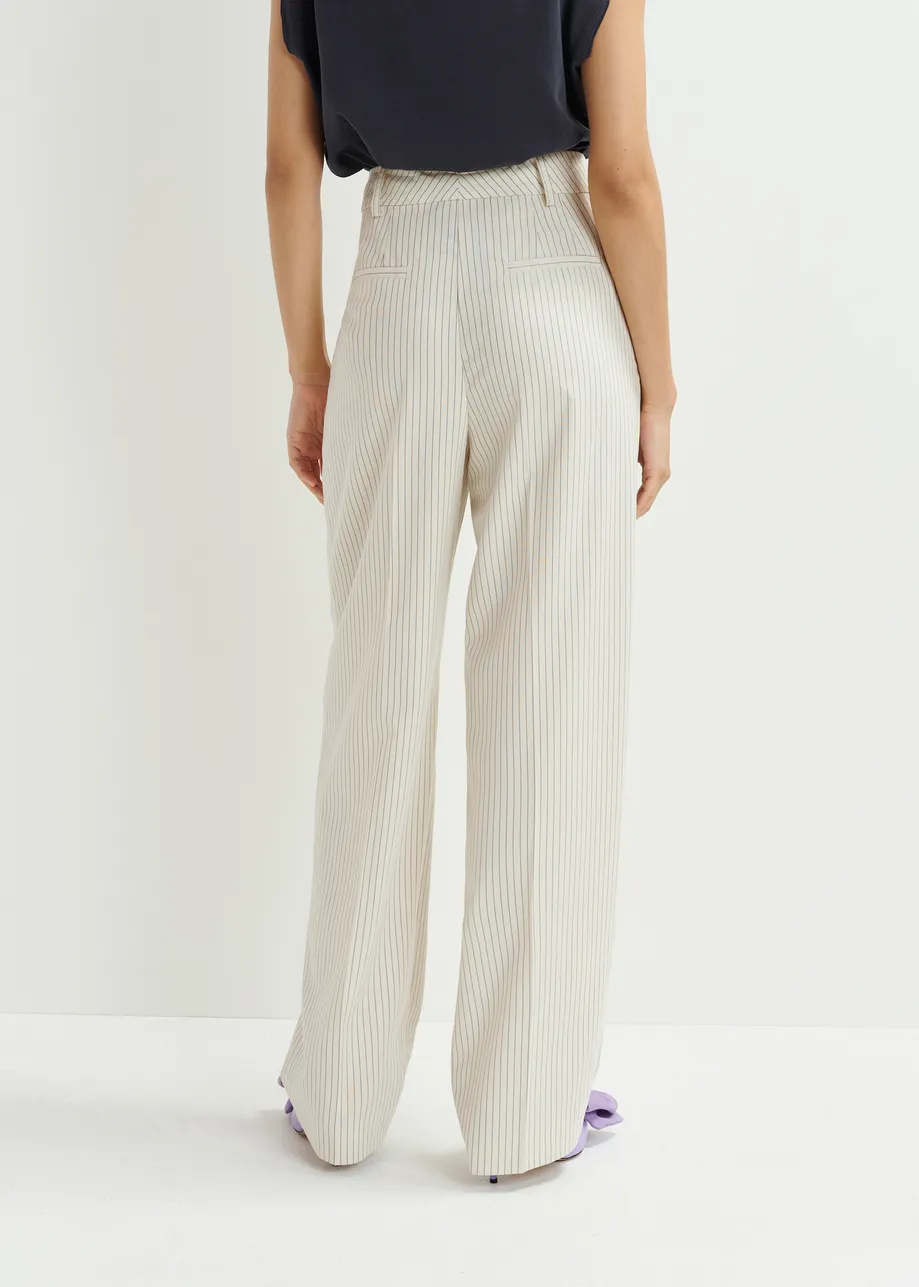 Dark blue and white pinstriped tapered leg pants